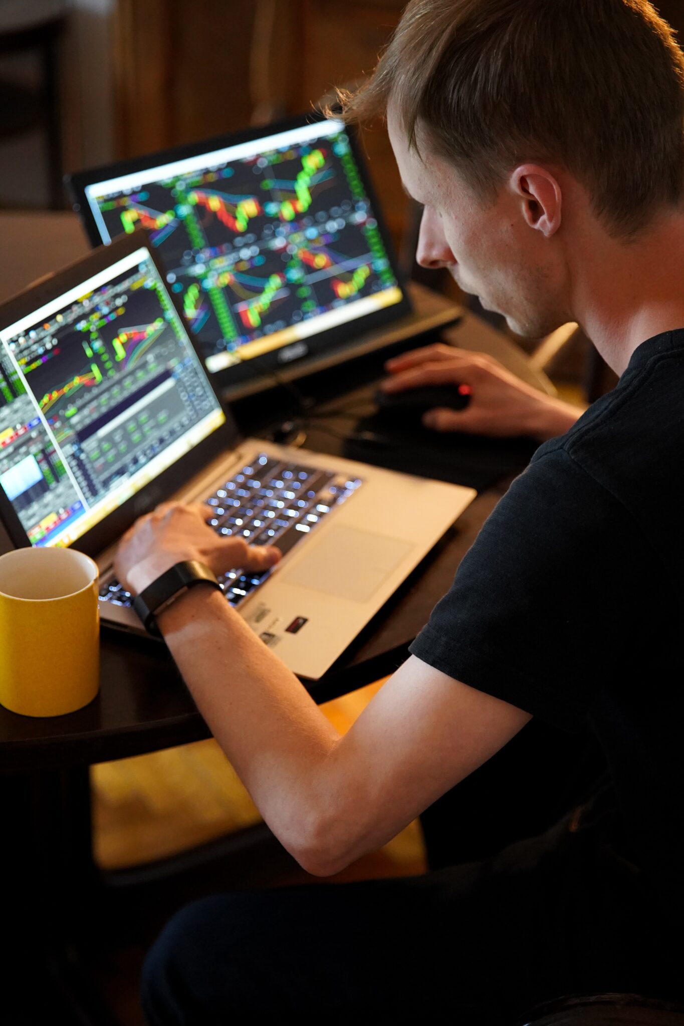 man typing on laptop